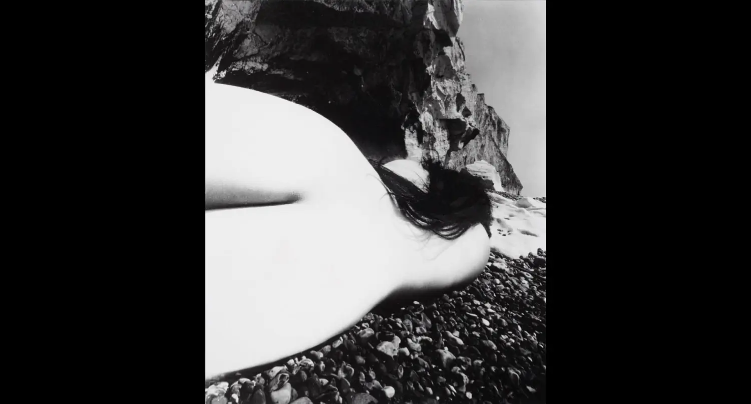 Nude, East Sussex Coast by Bill Brandt, a surreal wide-angle nude on a beach.